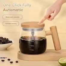 Coffee maker with wooden handle on a wooden surface, surrounded by coffee beans and a lime.