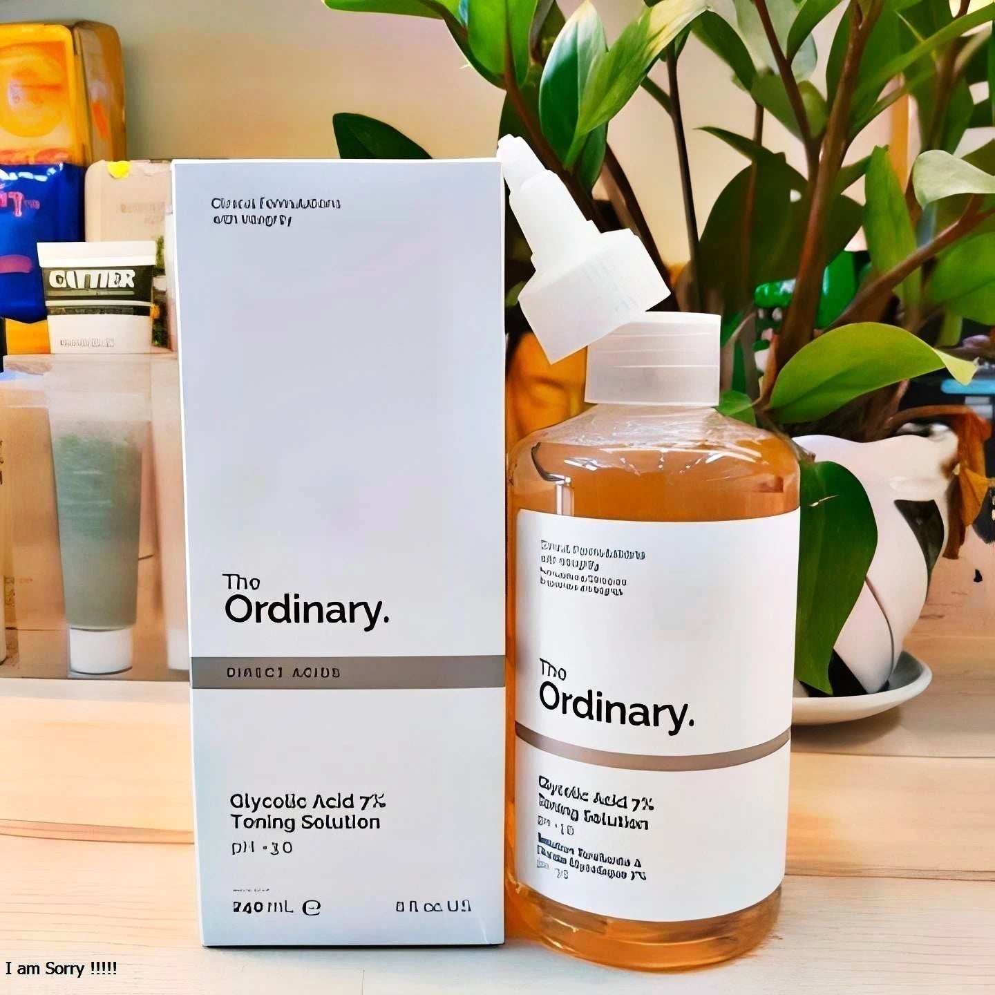 The Ordinary skincare product on a wooden surface with a plant in the background
