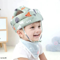 Child wearing a patterned head support device with a white background